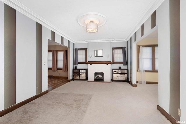 unfurnished living room with a brick fireplace, crown molding, and carpet flooring