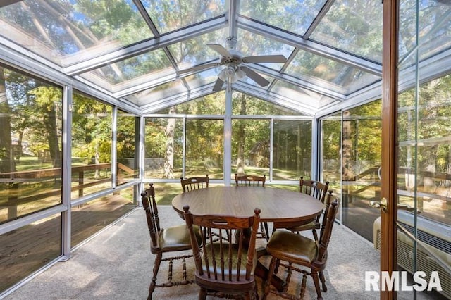 sunroom featuring ceiling fan and lofted ceiling