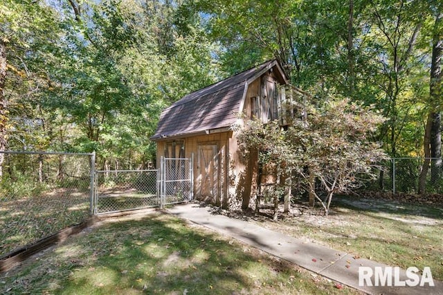 view of outbuilding with a lawn