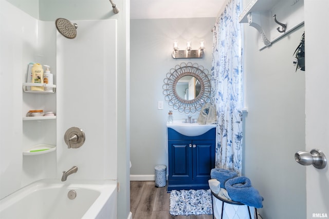 bathroom featuring vanity, hardwood / wood-style floors, and shower / bathtub combination with curtain