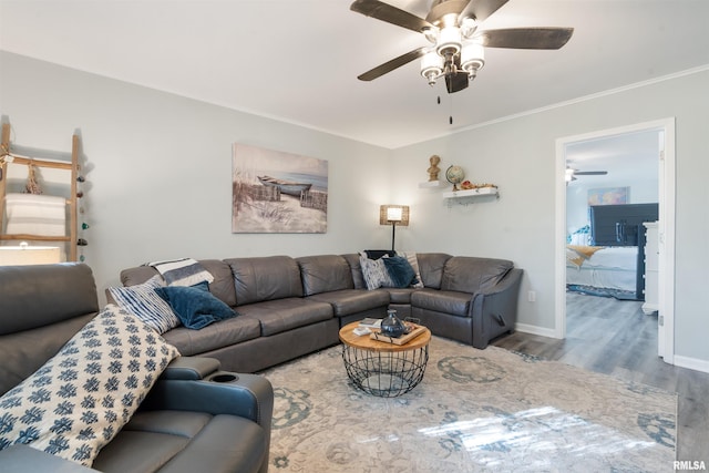 living room featuring ceiling fan and hardwood / wood-style flooring