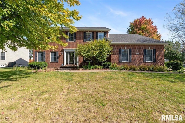 colonial home with a front yard and cooling unit