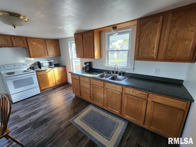 kitchen featuring dark wood-type flooring, sink, and white electric range