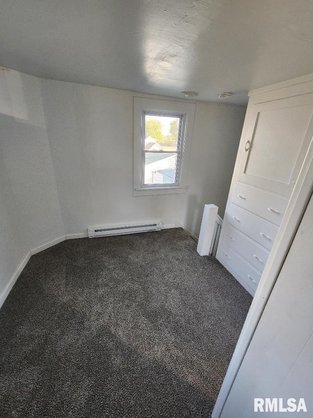 interior space with a baseboard radiator and carpet