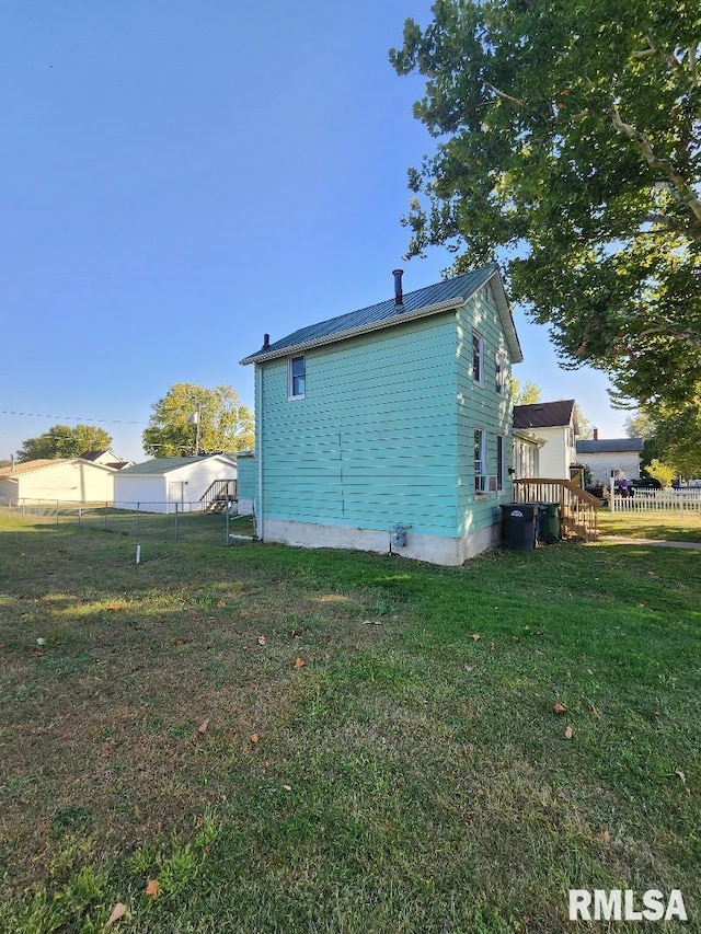 view of property exterior featuring a lawn