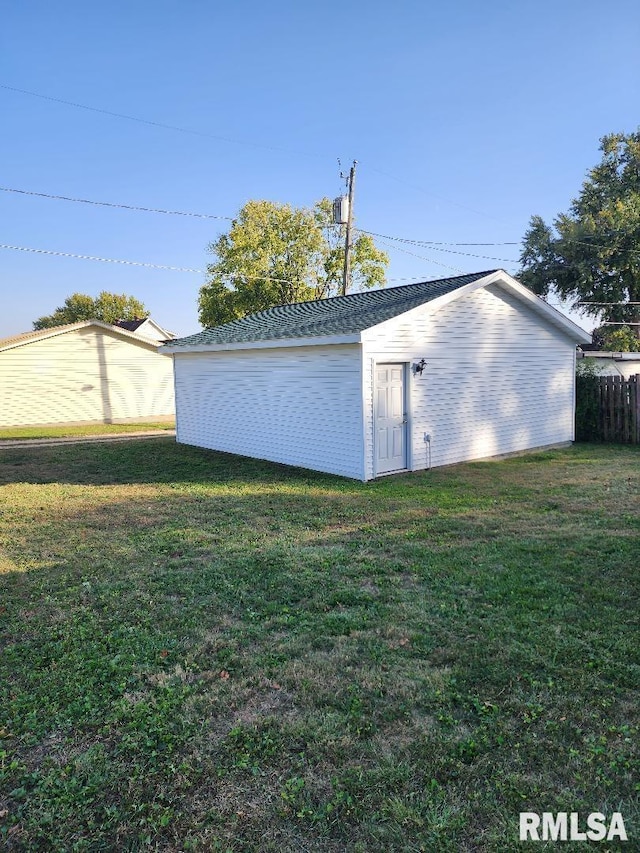 view of outdoor structure with a lawn