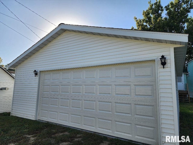 garage featuring wood walls