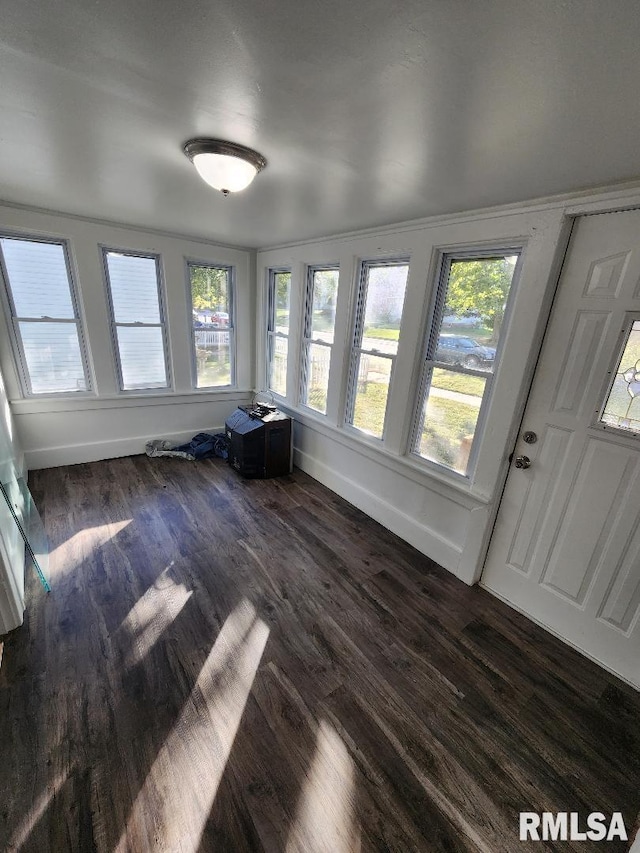 unfurnished sunroom featuring a healthy amount of sunlight