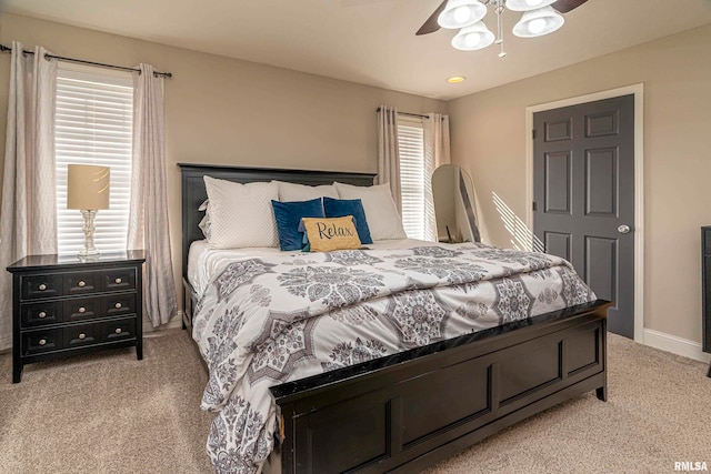 bedroom with light carpet and ceiling fan