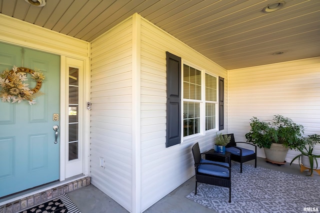 entrance to property featuring a porch