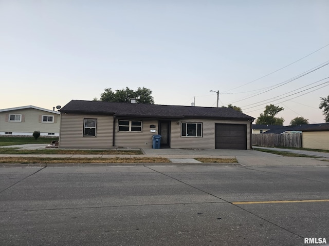 ranch-style home featuring a garage