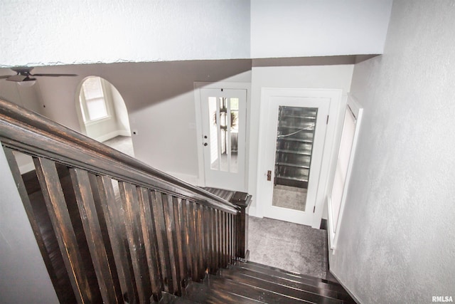 stairs featuring hardwood / wood-style flooring