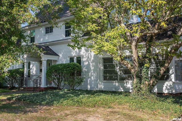 view of home's exterior featuring a yard