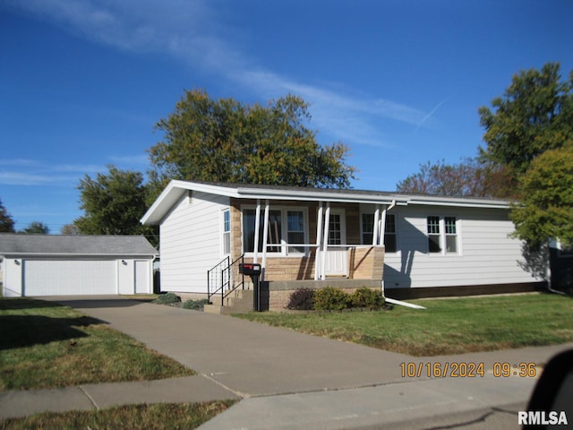 view of front of home with an outdoor structure, a garage, a front lawn, and a porch