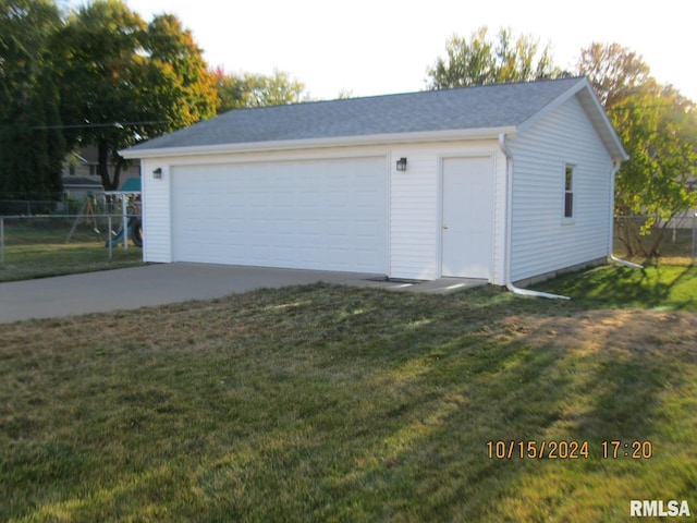 garage with a yard