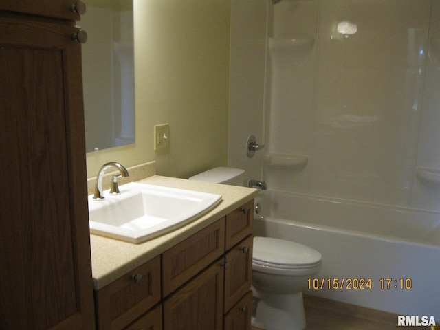 full bathroom featuring shower / bathing tub combination, vanity, and toilet