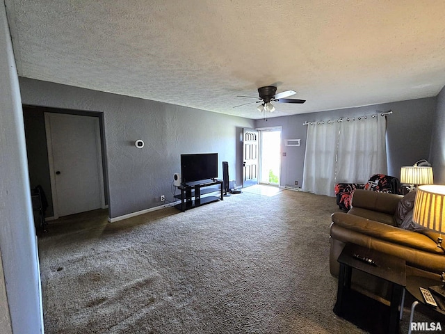 living room with carpet floors, a textured ceiling, and ceiling fan