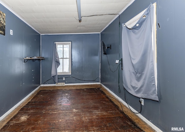 interior space with baseboards and dark wood finished floors