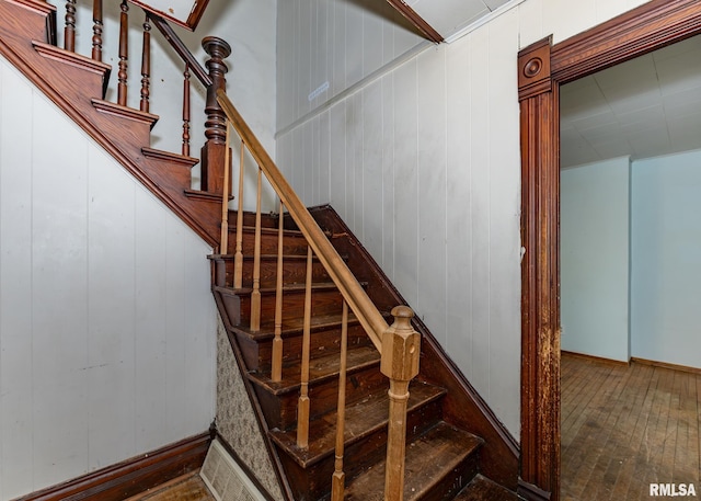 stairs with hardwood / wood-style floors