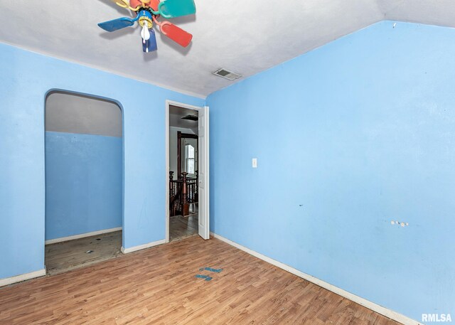 bonus room featuring lofted ceiling, ceiling fan, and dark hardwood / wood-style floors