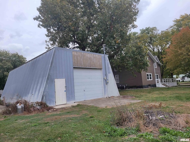 garage featuring a yard