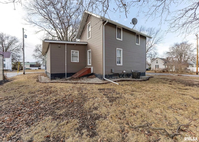 back of property with central air condition unit