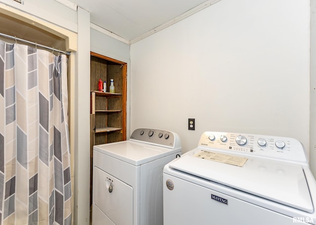 washroom featuring laundry area and separate washer and dryer