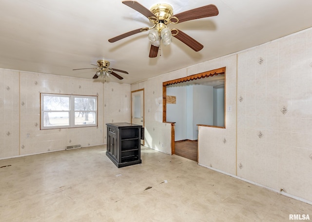 unfurnished living room featuring visible vents