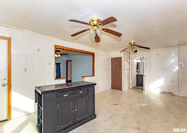 kitchen featuring decorative backsplash, dark brown cabinets, ceiling fan, and stainless steel electric range