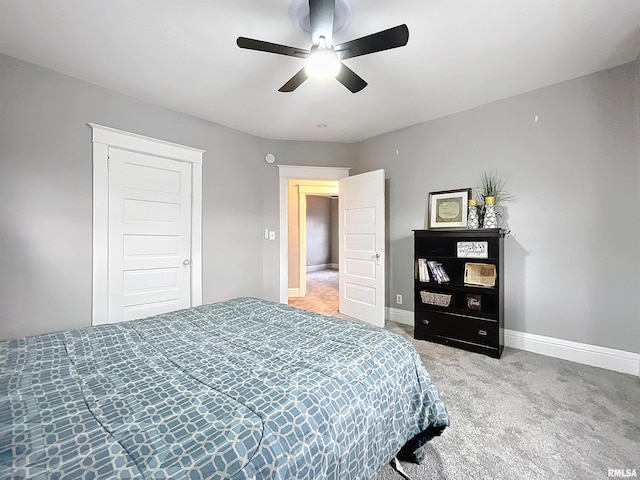 carpeted bedroom featuring ceiling fan