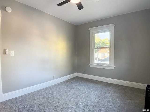 unfurnished room featuring carpet and ceiling fan