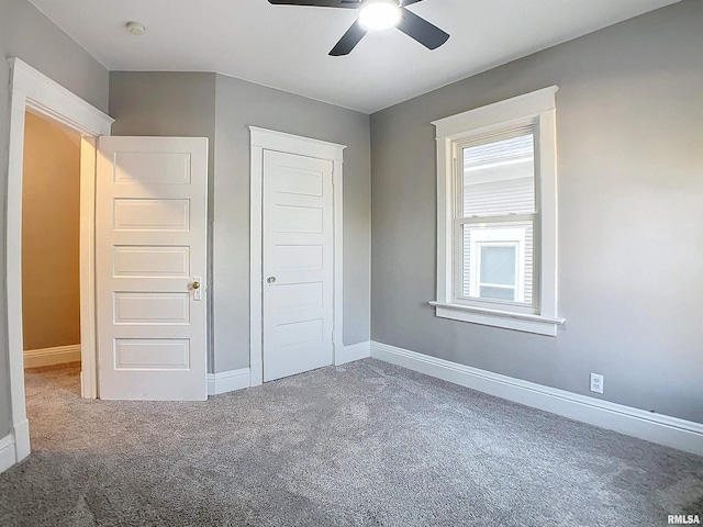 unfurnished bedroom featuring ceiling fan, carpet floors, and a closet