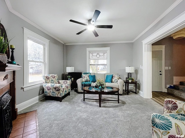 living room featuring ceiling fan, a healthy amount of sunlight, and ornamental molding