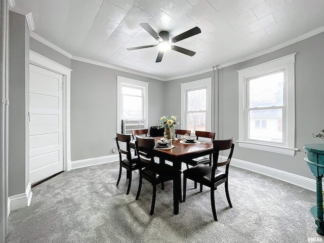 dining space featuring carpet flooring, plenty of natural light, and crown molding