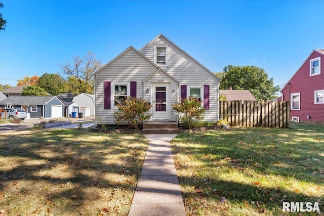 bungalow featuring a front yard