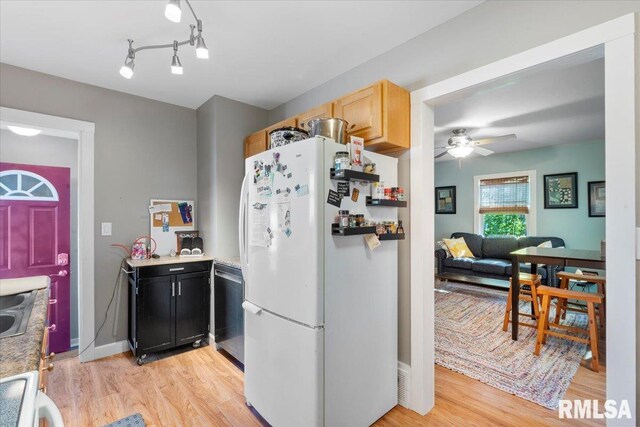 kitchen with light hardwood / wood-style floors, ceiling fan, light brown cabinetry, dishwasher, and white fridge