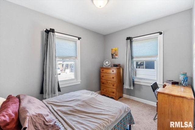 bedroom featuring light colored carpet