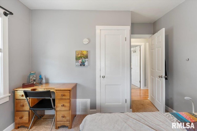 bedroom with light carpet