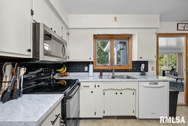 kitchen featuring black electric range oven, decorative backsplash, white cabinetry, dishwasher, and sink