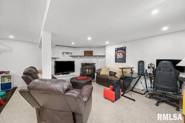 living room with a textured ceiling, a brick fireplace, and light colored carpet