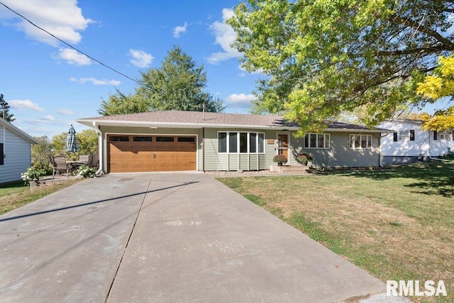 view of front of home with a front lawn and a garage