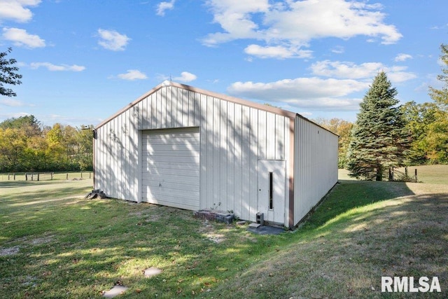 view of outbuilding featuring a yard and a garage