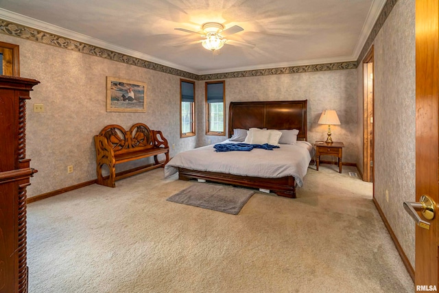 carpeted bedroom with ornamental molding and ceiling fan