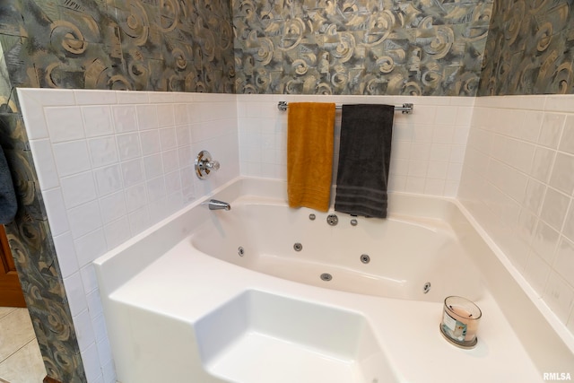 bathroom featuring a tub and tile walls