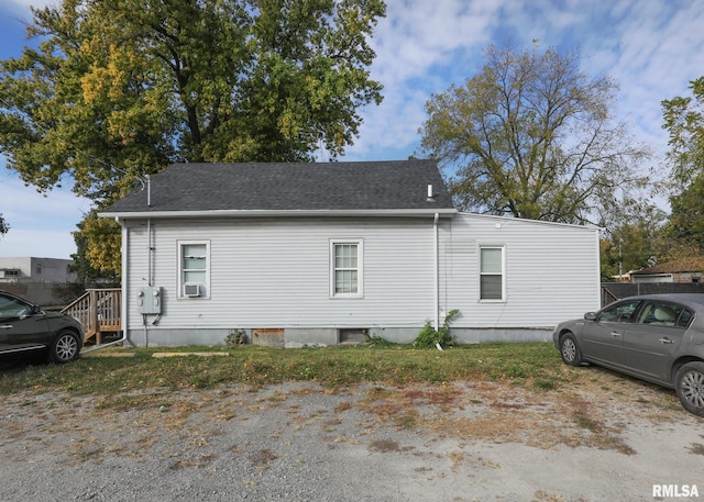 view of side of property featuring cooling unit