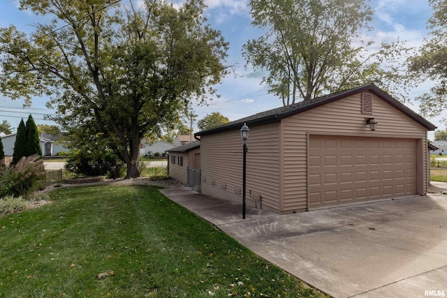 garage featuring a yard