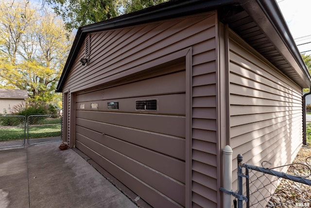 view of side of home with an outbuilding and a garage