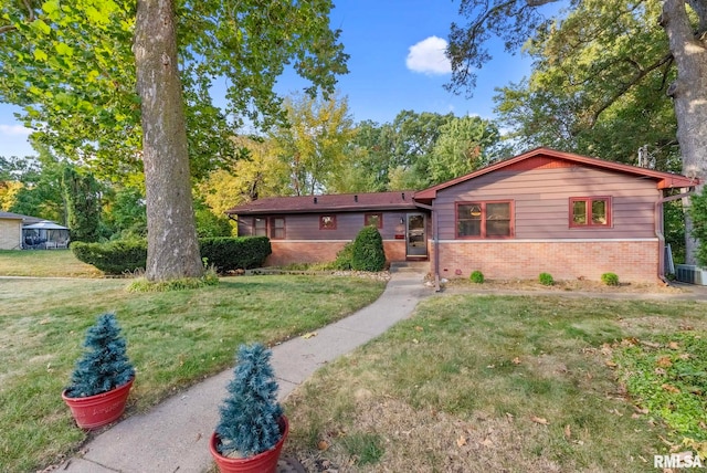 ranch-style house with a front lawn