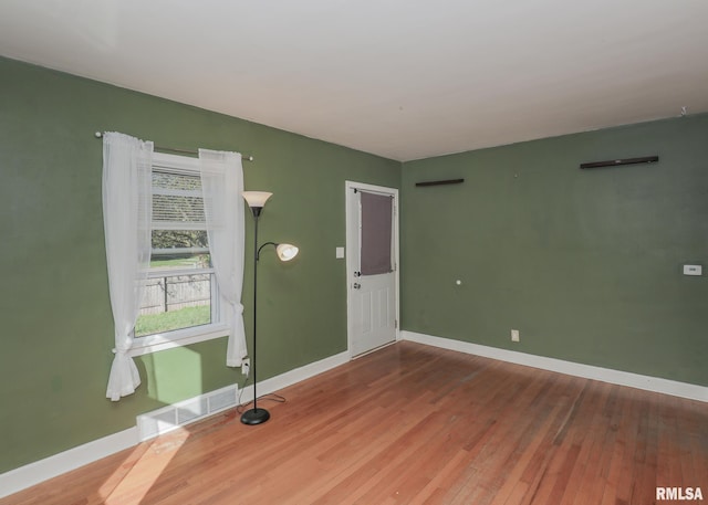 empty room featuring hardwood / wood-style flooring