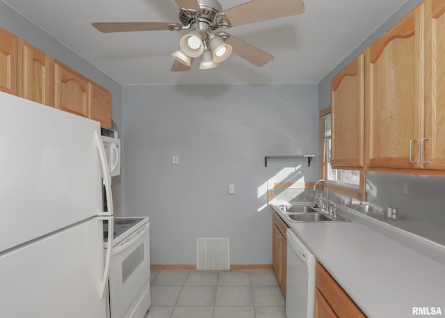 kitchen with white appliances, light brown cabinetry, light tile patterned flooring, sink, and ceiling fan